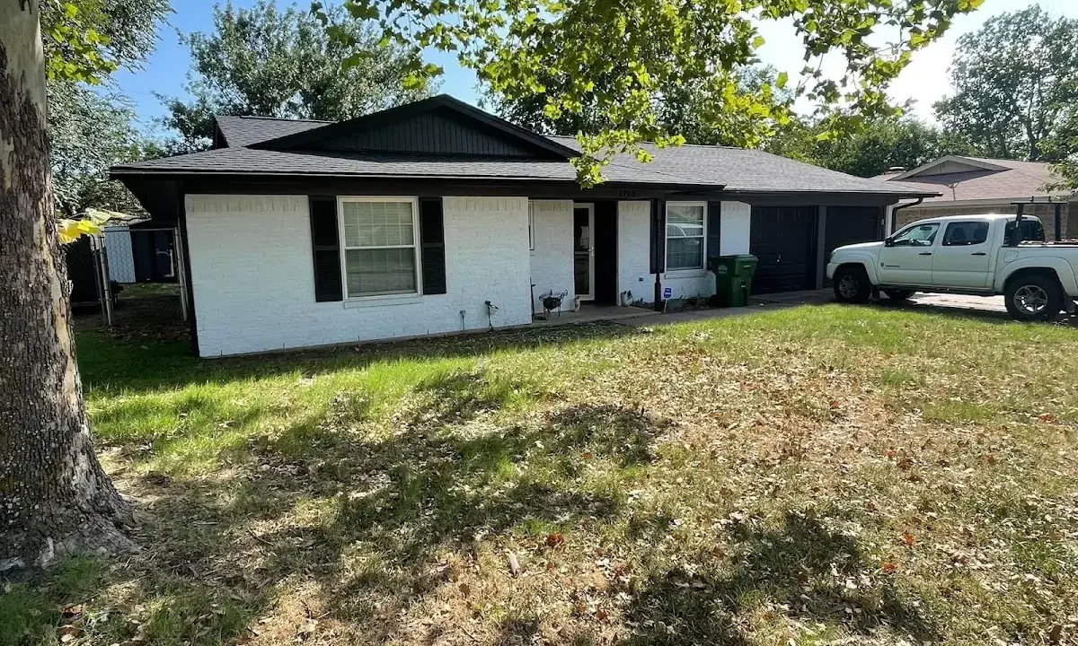 Professional roofing crew working on a residential roof in Moses Lake